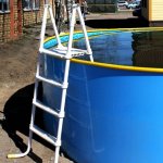 The Pool Ladder With Her Hands